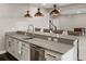 Stylish bar area with sleek countertops, stainless steel appliances, and comfortable seating for entertaining at 6766 Mentha Dr, Castle Rock, CO 80108