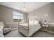 Bedroom with vintage furniture and a large window providing ample natural light at 6766 Mentha Dr, Castle Rock, CO 80108