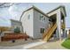 Beautiful home showcasing a lush landscaped front yard, a staircase and neutral siding at 6766 Mentha Dr, Castle Rock, CO 80108