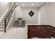 Basement game room with foosball table, bar table with stools, dartboard, and access to upper floor at 6766 Mentha Dr, Castle Rock, CO 80108