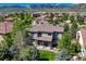 Aerial view of the house showing the backyard with a covered patio, pergola and mountain views at 15235 W Iliff Ave, Lakewood, CO 80228