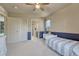 The bedroom features a view to the bathroom, closet and natural lighting at 15235 W Iliff Ave, Lakewood, CO 80228