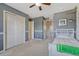 Another view of the cozy bedroom features a closet and gray wall at 15235 W Iliff Ave, Lakewood, CO 80228