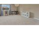 This bedroom has neutral walls, large window and dark furniture at 15235 W Iliff Ave, Lakewood, CO 80228