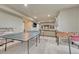 Recreation area features ping pong table, foosball table, and bar with seating at 15235 W Iliff Ave, Lakewood, CO 80228