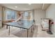 Entertaining game room equipped with ping pong and foosball tables, and bar at 15235 W Iliff Ave, Lakewood, CO 80228