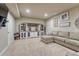 Inviting living room with recessed lights, ample seating, and custom entertainment center at 15235 W Iliff Ave, Lakewood, CO 80228