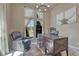 Bright office with a large window, comfortable seating, a stylish desk, and modern decor at 15235 W Iliff Ave, Lakewood, CO 80228
