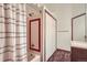 Bathroom featuring a shower/tub combo and a double door closet at 1661 S Fulton St, Aurora, CO 80247