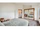Spacious bedroom with a mirrored closet and neutral decor at 1661 S Fulton St, Aurora, CO 80247