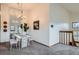 Elegant dining area features a large mirror and access to the staircase at 1661 S Fulton St, Aurora, CO 80247