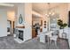 Stylish dining area with modern chandelier, adjacent to the kitchen and living spaces at 1661 S Fulton St, Aurora, CO 80247