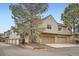 Inviting townhouse complex with well-maintained landscaping and attached garages on a sunny day at 1661 S Fulton St, Aurora, CO 80247