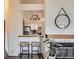 View into the kitchen with breakfast bar seating and modern lighting at 1661 S Fulton St, Aurora, CO 80247