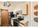 Bright kitchen featuring stainless steel appliances, white cabinets, and wood countertop at 1661 S Fulton St, Aurora, CO 80247