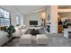 Bright living room with large windows, neutral tones, and a modern fireplace, creating a cozy space at 1661 S Fulton St, Aurora, CO 80247