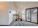Loft area with a large window and a sliding glass door to a balcony at 1661 S Fulton St, Aurora, CO 80247
