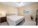 Clean bedroom with neutral walls, carpet, a cozy bed, side table and window for natural light at 895 Vance St, Lakewood, CO 80214