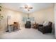 Bright room with neutral walls, ceiling fan, carpeted floors, and windows for lots of natural light at 895 Vance St, Lakewood, CO 80214