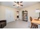 Neutral room features a ceiling fan, carpeted floors, a closet, and windows for lots of natural light at 895 Vance St, Lakewood, CO 80214