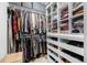 Well-organized walk-in closet with ample hanging space and built-in shelving at 895 Vance St, Lakewood, CO 80214