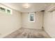 Basement room with plush carpet, windows for natural light, and accessible power outlets at 430 S Potomac Cir, Aurora, CO 80012