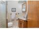 Bathroom featuring a single sink vanity and shower at 430 S Potomac Cir, Aurora, CO 80012