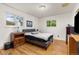 Bright bedroom with hardwood floors and two windows offering natural light at 430 S Potomac Cir, Aurora, CO 80012
