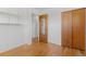 Bedroom featuring hardwood floors and ample closet space at 430 S Potomac Cir, Aurora, CO 80012