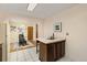 Kitchen view featuring an island with bar seating and an adjacent dining area at 430 S Potomac Cir, Aurora, CO 80012