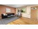 Comfortable living room with hardwood floors, a modern sofa, and bright natural light at 430 S Potomac Cir, Aurora, CO 80012