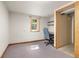 Carpeted room with window offering natural light plus a dedicated desk and chair at 430 S Potomac Cir, Aurora, CO 80012