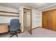 Office space in basement with built in shelving and bonus closet space at 430 S Potomac Cir, Aurora, CO 80012