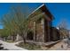 Exterior shot of community building with stone features at 13456 Via Varra # 208, Broomfield, CO 80020