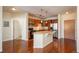 Well-equipped kitchen with stainless steel appliances, a breakfast bar, and wood cabinets at 13456 Via Varra # 208, Broomfield, CO 80020