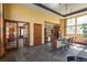 Modern kitchenette with sleek countertops, wood cabinets, and a breakfast bar, perfect for casual dining and entertaining at 13456 Via Varra # 208, Broomfield, CO 80020