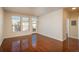 Bright and airy living room with large windows and a door to the balcony at 13456 Via Varra # 208, Broomfield, CO 80020