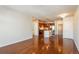 Bright living room showcasing hardwood floors and a view of the modern kitchen at 13456 Via Varra # 208, Broomfield, CO 80020