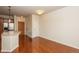 Spacious living room featuring hardwood floors and ample natural light at 13456 Via Varra # 208, Broomfield, CO 80020