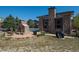 Outdoor fireplace with grill and seating, perfect for gathering with friends and Gathering at 13456 Via Varra # 208, Broomfield, CO 80020