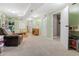 A spacious basement with an inviting play area and neutral carpeting, perfect for Gathering activities at 3326 S Geneva St, Denver, CO 80231