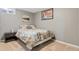 Comfortable bedroom with a floral-patterned bedspread, neutral walls, and soft carpeting at 3326 S Geneva St, Denver, CO 80231