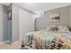 Cozy bedroom with carpet, closet and floral-patterned bedding at 3326 S Geneva St, Denver, CO 80231