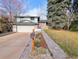 Charming two-story home with a well-manicured front yard, brick walkway, and attached two-car garage at 3326 S Geneva St, Denver, CO 80231