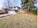 Exterior view of home with a manicured lawn and garden, offering a welcoming appeal at 3326 S Geneva St, Denver, CO 80231