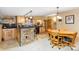 Entertaining bar area with stone accents, wooden cabinets, and adjacent seating at 150 Hess Ave, Golden, CO 80401