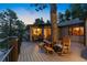 Relax on this spacious deck with built-in seating, stunning sunset views, and a unique tree feature at 150 Hess Ave, Golden, CO 80401