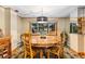 Cozy dining room with a round wooden table, chairs and a view at 150 Hess Ave, Golden, CO 80401