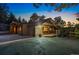 Stunning home exterior with a paved driveway, wood accents, and lovely landscaping, offering curb appeal at 150 Hess Ave, Golden, CO 80401