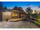 Beautiful home exterior with a paved driveway, wood accents, and lovely landscaping, offering curb appeal at 150 Hess Ave, Golden, CO 80401